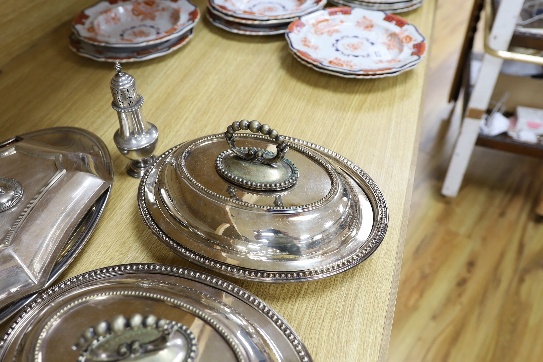 A silver sugar castor and sundry plated ware